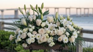 Professional photo of spring funeral flowers with coastal background, morning light, emotional atmosphere, Jacksonville waterfront