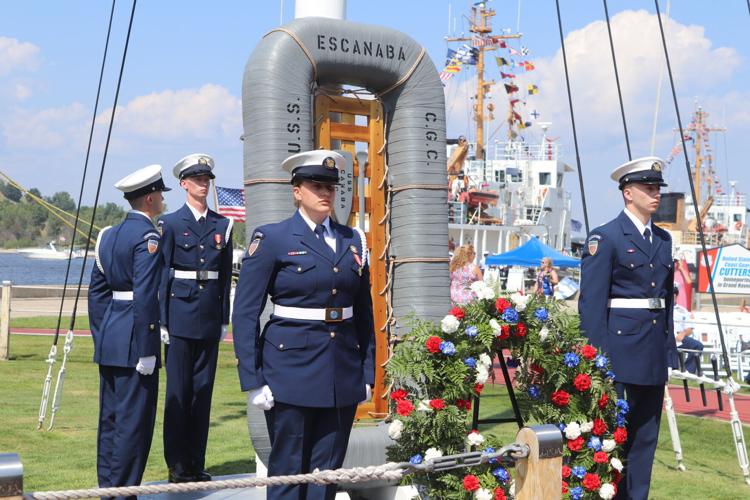 Coast guard memorial service with red, white and blue funeral wreath